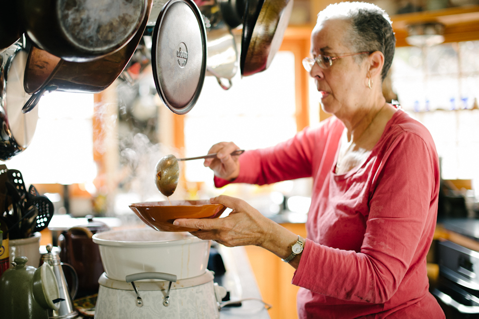 Leni Sorensen PHD serving soup in her kitchen at Indigo House